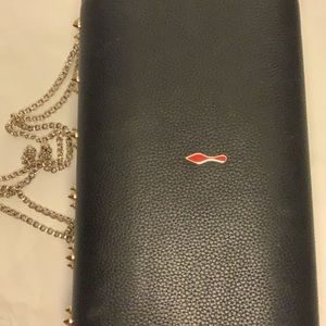Louboutin hand bag spikes sexy as new